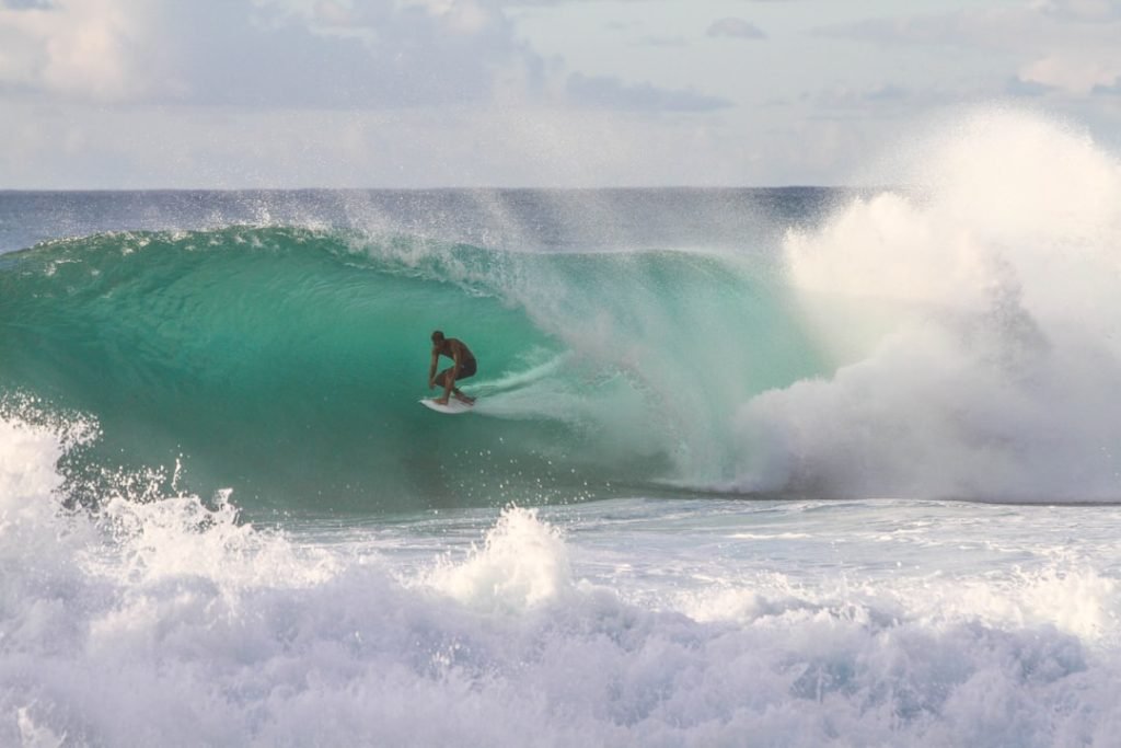 Surfer in the foaming water